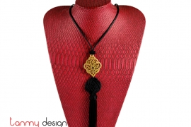 Necklace designed with pattern pendant and black tassel